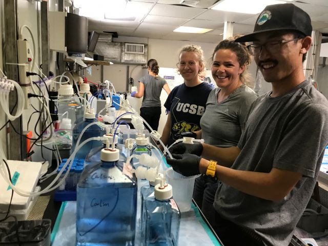 Carlson Lab members at work in the on-board lab