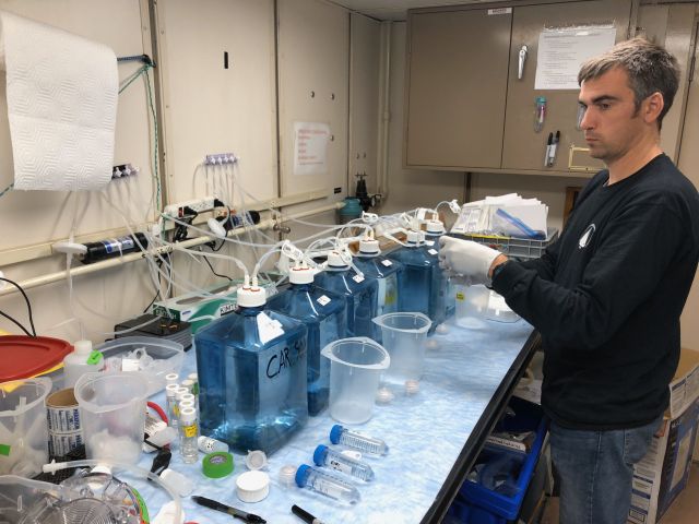 Post-Doc Brandon Stephens sampling from experiments on board
